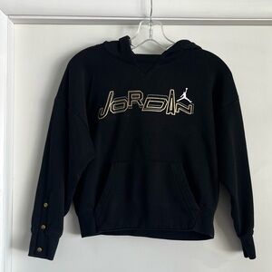 Youth Jordan black hoodie with gold logo. Some wear & light pilling. YM 10/12